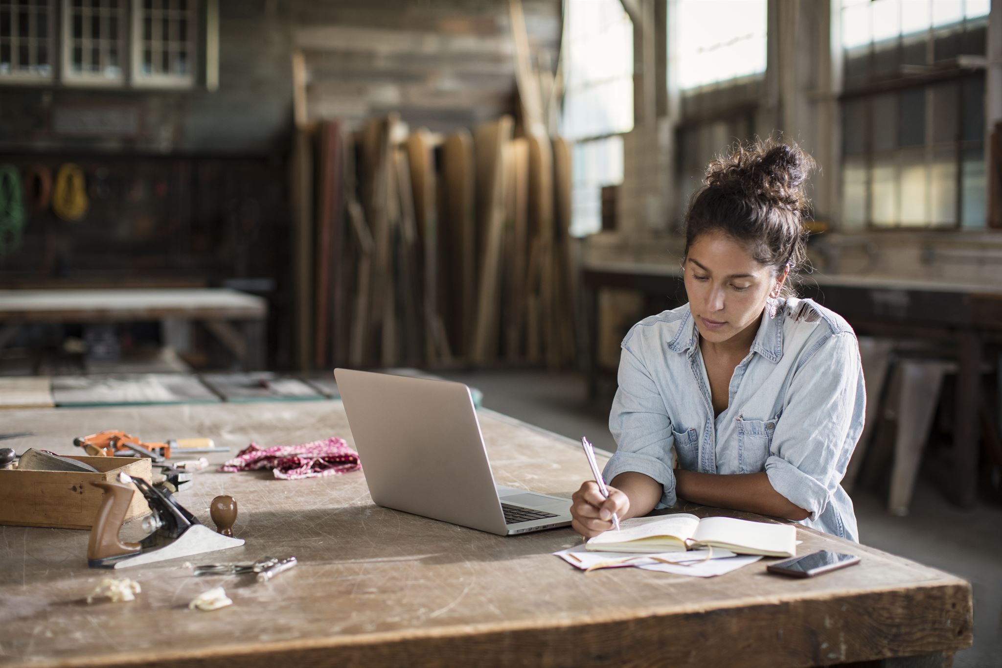 Woman-writing-on-notebook